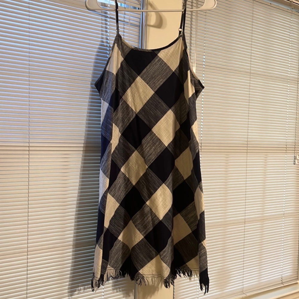 Universal Threads. Buffalo check, fringe on bottom. Above knee. Large.